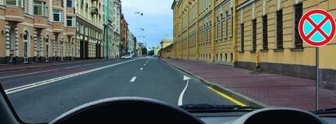 Which of the signs applies only to the lane above which it is suspended?
