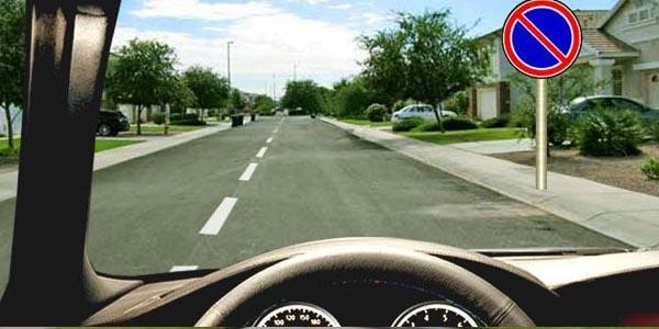 Which vehicles are allowed to park within the area affected by this traffic sign?