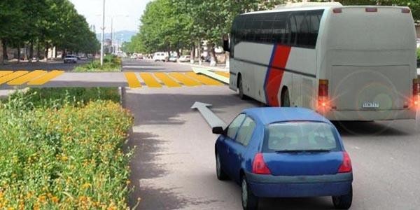 What should the driver of a light passenger vehicle do if the bus driver starts braking?
