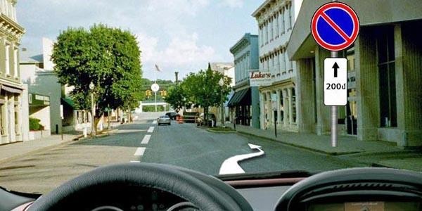 Is stopping allowed in the area of influence of the indicated road signs for the purpose of boarding or alighting passengers?