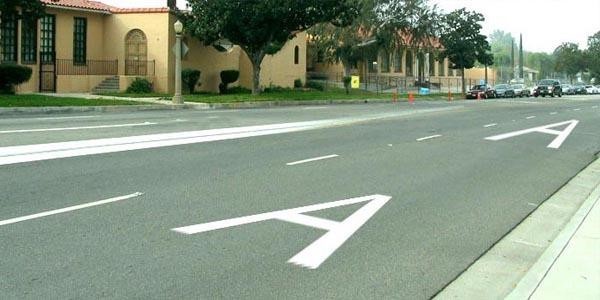 For which vehicles is the lane marked with the letter “A” reserved?
