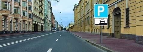 Is a driver of a light truck (under 3.5 tons) allowed to park as indicated by the sign?
